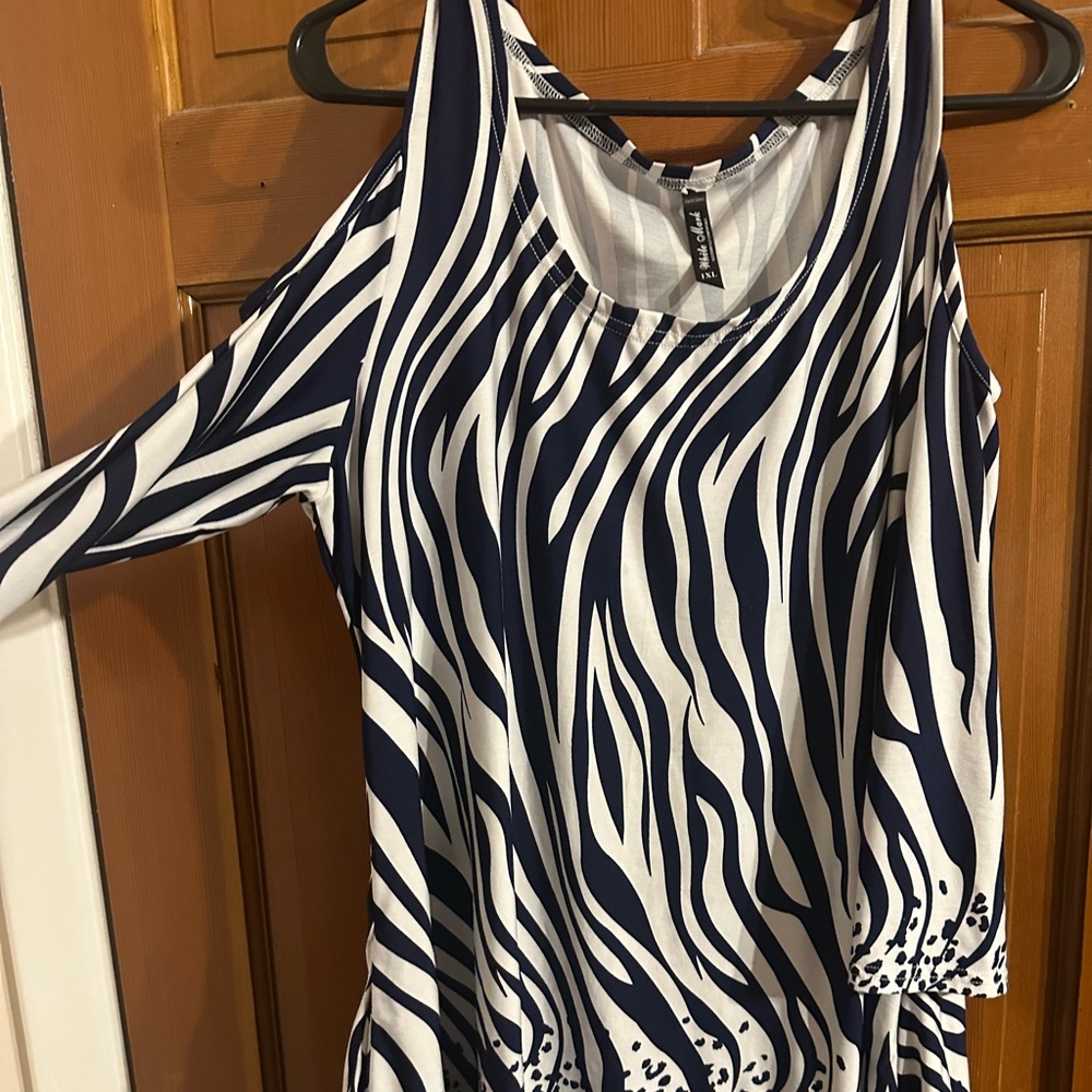 Blue and white 
Off the shoulder and arms 
Scalloped bottom